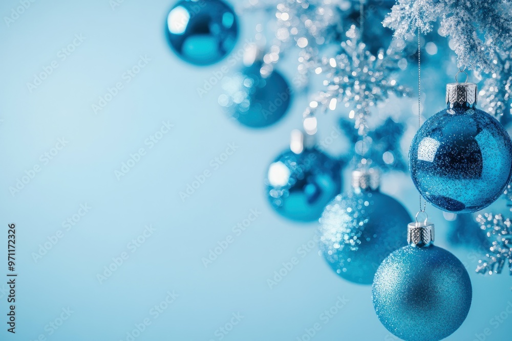 Blue Christmas Ornaments Hanging from a Snowy Branch Blue Christmas Ornaments Hanging from a Snowy Branch