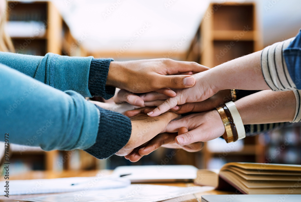Hands, stack and group of students for learning, books or solidarity for goal, exam or education. People, huddle or scrum for motivation, trust or study for development in library, hall or university Hands, stack and group of students for learning, books or solidarity for goal, exam or education. People, huddle or scrum for motivation, trust or study for development in library, hall or university