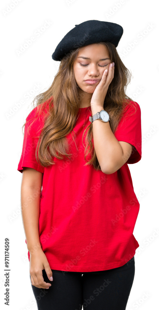 Young beautiful brunette fashion woman wearing red t-shirt and black beret over isolated background thinking looking tired and bored with depression problems with crossed arms. Young beautiful brunette fashion woman wearing red t-shirt and black beret over isolated background thinking looking tired and bored with depression problems with crossed arms.