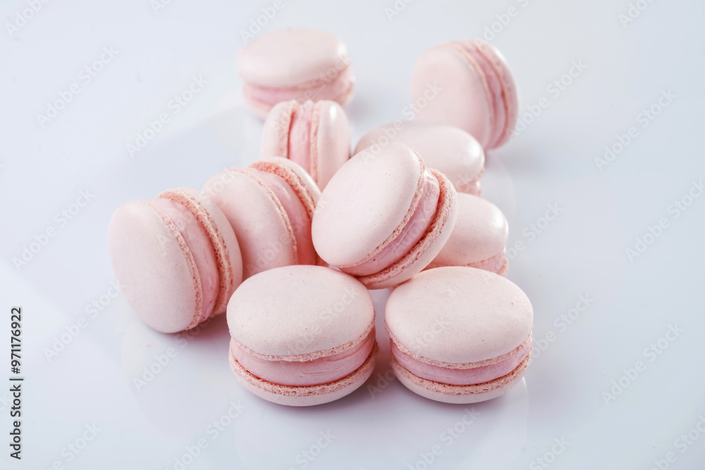 Fototapeta premium Pink colored. Bunch of macarons on the white surface