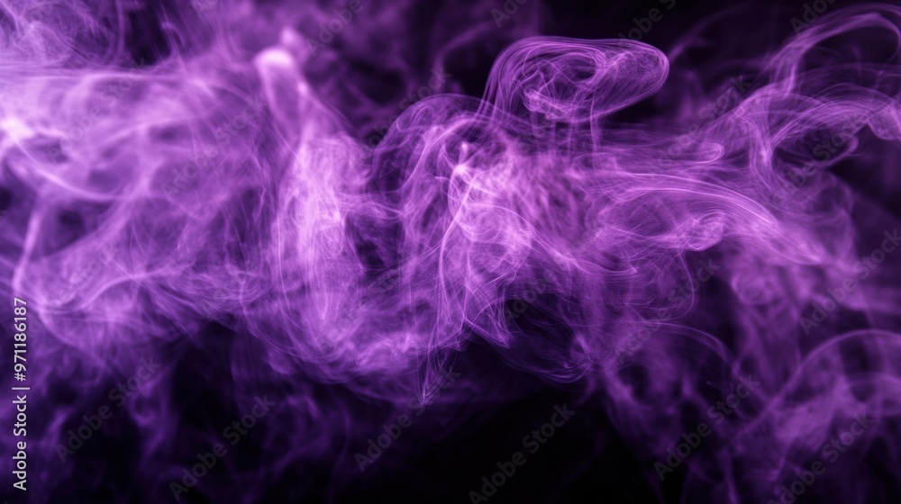 Fototapeta premium A close-up of purple smoke swirling against a black background, creating a mysterious and abstract effect