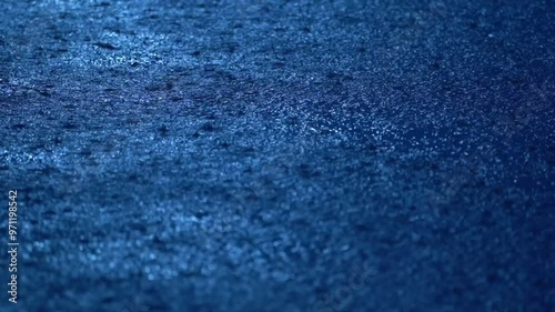 Close-up of heavy rain falling on the water surface, Severe thunderstorm