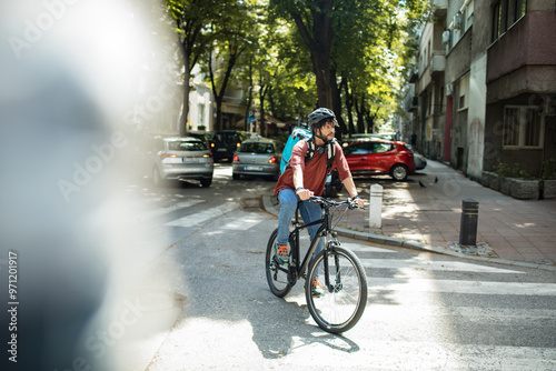 Delivery man biking through city street with a backpack