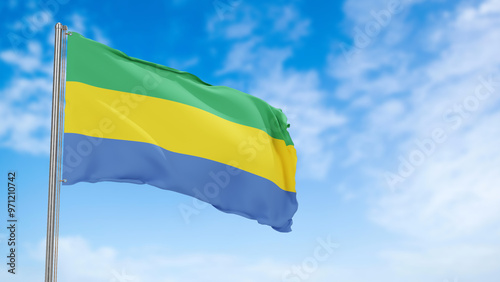 gabon flag in the blue sky.gabon 3d flag floating in the wind with a blue sky in the background photo