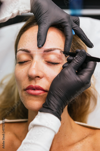 Precision eyebrow design and tweezing premicroblading session photo