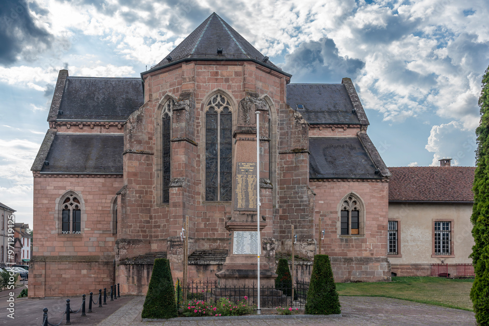 Étival-Clairefontaine, France - 09 01 2024: Saint-Pierre Abbey. Panoramic view outside of the back of the abbey and the war memorial. Étival-Clairefontaine, France - 09 01 2024: Saint-Pierre Abbey. Panoramic view outside of the back of the abbey and the war memorial.