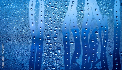 Obraz na płótnie Water and raindrops on glass, Raindrops on blue glass background w salonie