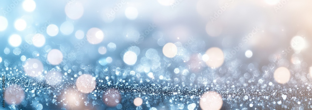 A beautiful blue background featuring shimmering bokeh lights creating a magical and dreamy atmosphere for various designs. A beautiful blue background featuring shimmering bokeh lights creating a magical and dreamy atmosphere for various designs.