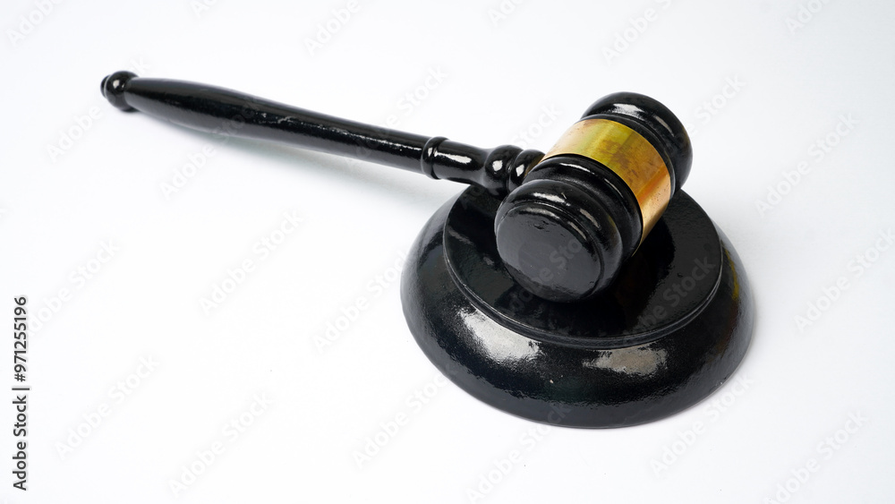Judge's gavel or black auction wooden gavel on stand on white background Judge's gavel or black auction wooden gavel on stand on white background