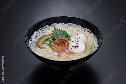 Nyumen, Boiled somen (Thin noodles made from flour. Sold in dried form ) poured with hot noodle soup base. Japanese cuisine. photo