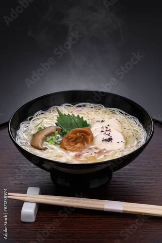 Nyumen, Boiled somen (Thin noodles made from flour. Sold in dried form ) poured with hot noodle soup base. Japanese cuisine. photo