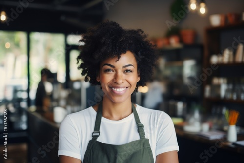 Smiling portrait of a young female barista