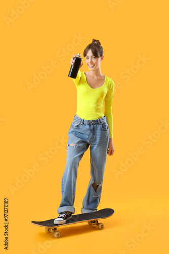 Young girl with spray can a...