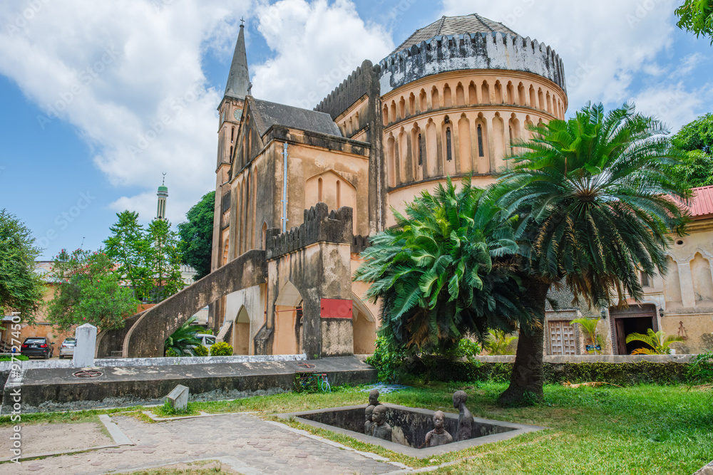 Fototapeta premium In Stone town, you can visit the cathedral and the exhibition where the slave trade took place and confront the evils of the past.