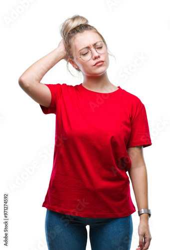 Young blonde woman wearing glasses over isolated background confuse and wonder about question. Uncertain with doubt, thinking with hand on head. Pensive concept.