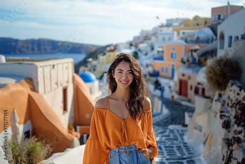 A traveler in a vibrant orange top enjoying the picturesque views of Santorini\'s charming streets on a sunny day photo