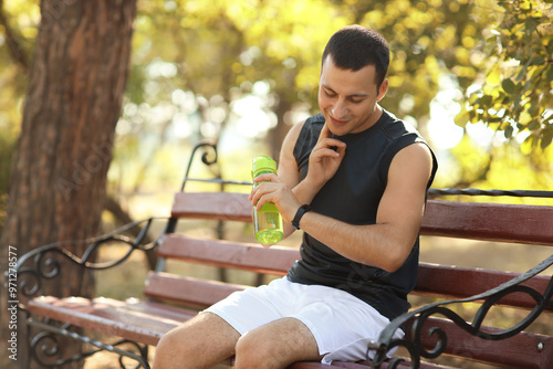 Sporty young man checking p...