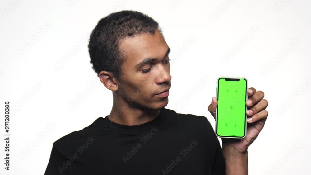Man holding smartphone with green screen Man holding smartphone with green screen