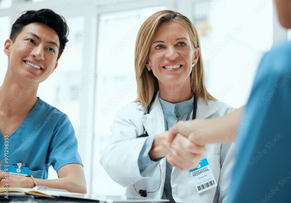 © KayExam/peopleimages.com - People, doctor and nurse with hand shake at boardroom for welcome and congratulations on internship. Employees, office and happy or smile with greeting for job interview, opportunity and recruitment