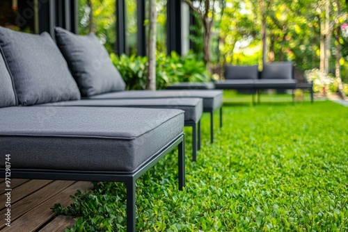 This is a beautiful and relaxing spot in the garden with a wooden deck terrace and comfortable chairs and sofas