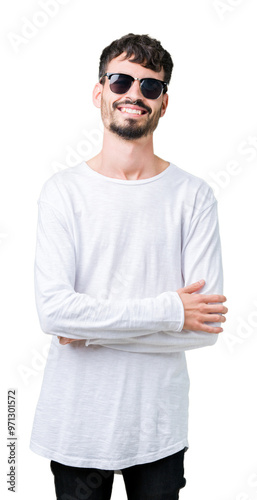 Young handsome man wearing sunglasses over isolated background happy face smiling with crossed arms looking at the camera. Positive person.