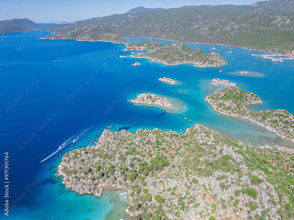 Naklejka premium The ancient city of Simana, founded by the Lycian civilization, the sunken city of Kekova, rock tombs, castle, sea and nature reveal its magnificence.