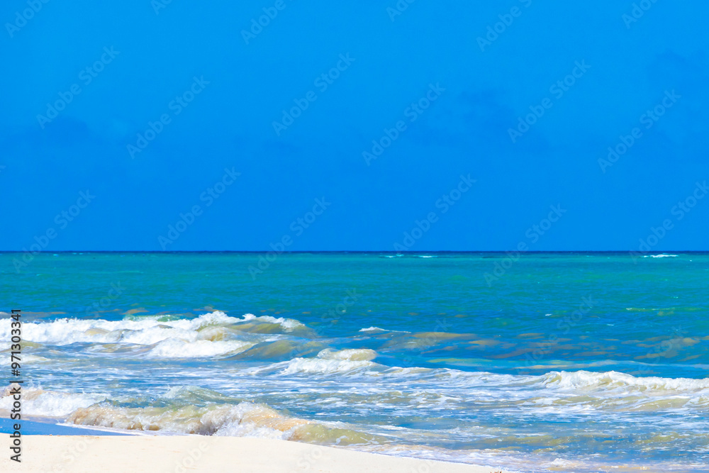 Fototapeta premium Tropical Caribbean beach clear water waves Playa del Carmen Mexico.