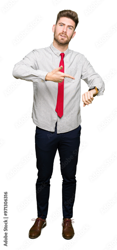 Young handsome business man In hurry pointing to watch time, impatience, upset and angry for deadline delay Young handsome business man In hurry pointing to watch time, impatience, upset and angry for deadline delay