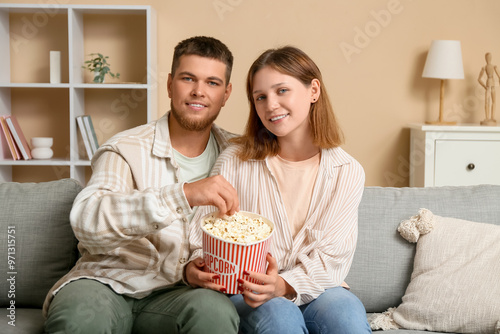 Young couple enjoying a mov...