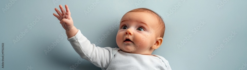 Newborn baby reaching out, symbolizing the start of a new life Newborn baby reaching out, symbolizing the start of a new life