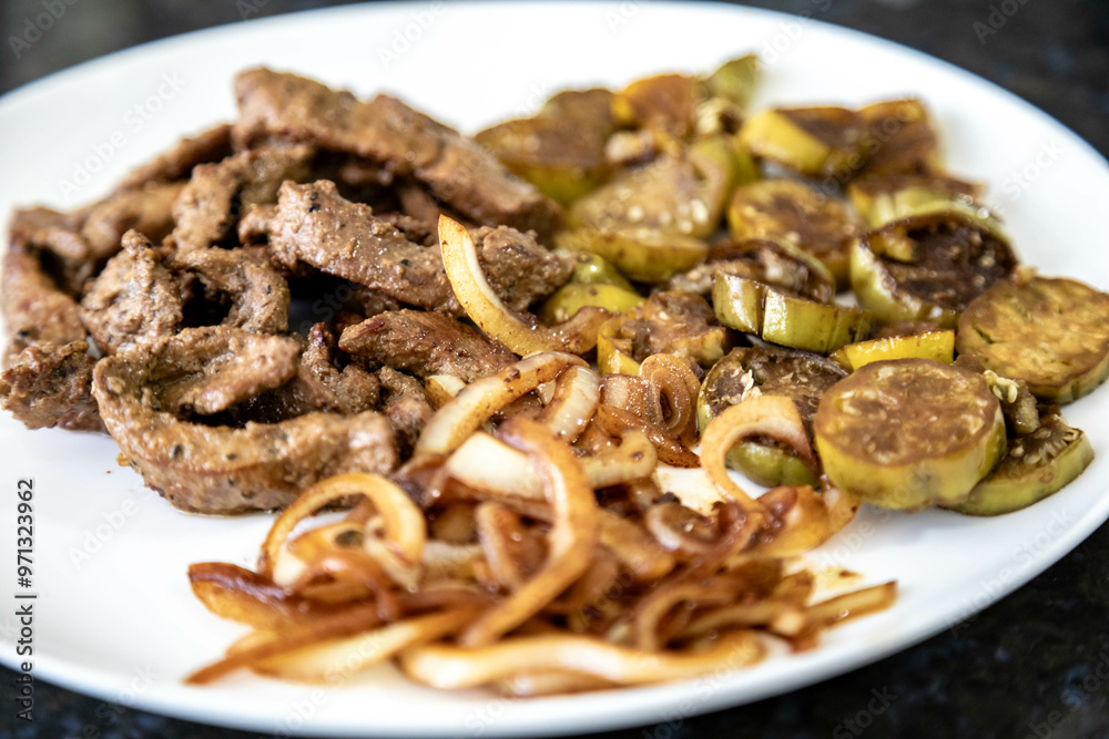 Traditional, strong and nutritious real food, liver with okra and onion Traditional, strong and nutritious real food, liver with okra and onion
