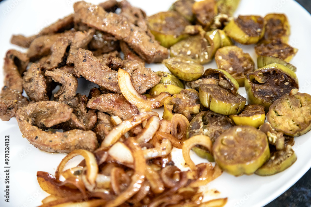 Traditional, strong and nutritious real food, liver with okra and onion Traditional, strong and nutritious real food, liver with okra and onion