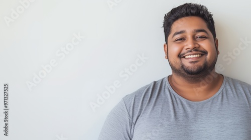 Happy man with beard smiles at the camera.