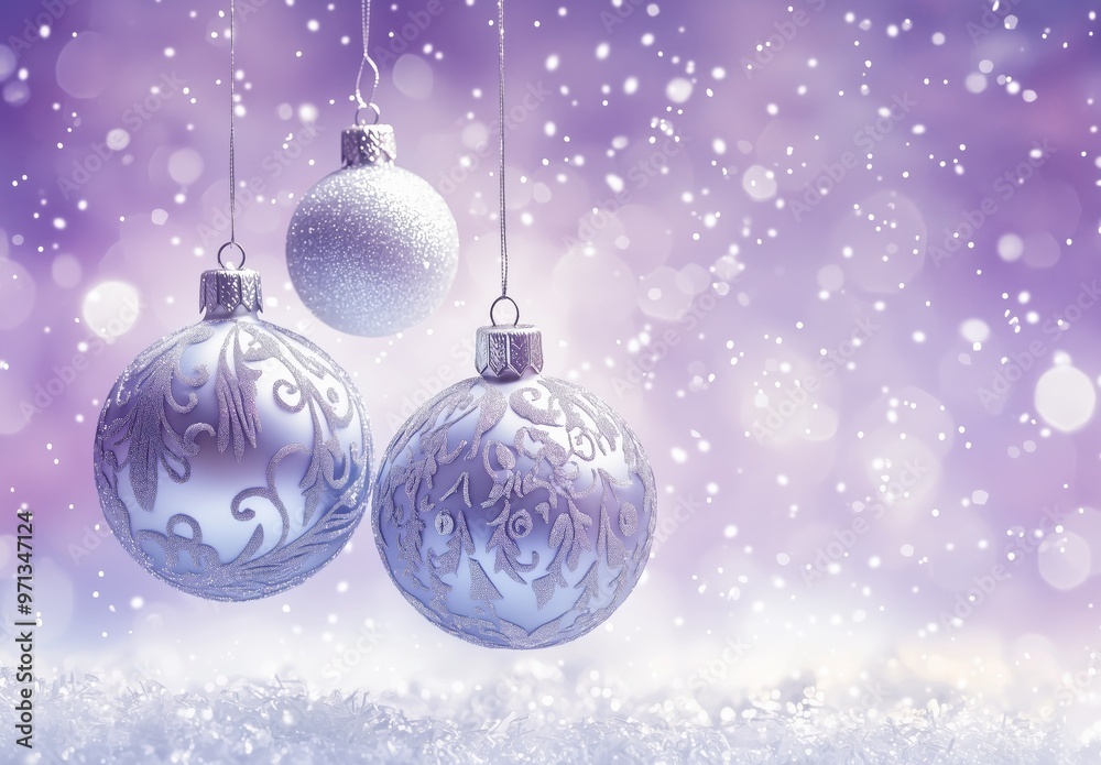 Beautiful silver and white Christmas ornaments hanging against a soft purple snowy background during the winter season Beautiful silver and white Christmas ornaments hanging against a soft purple snowy background during the winter season