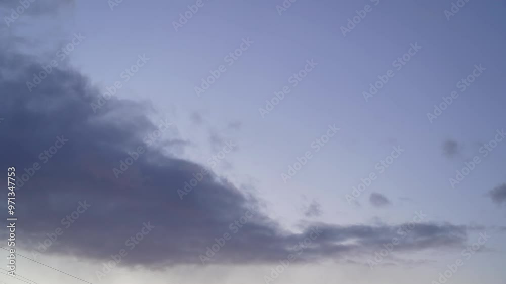 A stunning display of evening clouds accentuates the tranquil horizon as the sun sets, creating a peaceful ambiance in the sky A stunning display of evening clouds accentuates the tranquil horizon as the sun sets, creating a peaceful ambiance in the sky