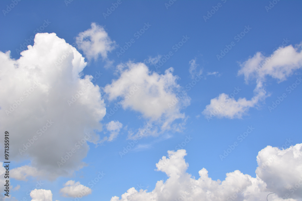 a cloud that is in the blue sky with some other clouds a cloud that is in the blue sky with some other clouds