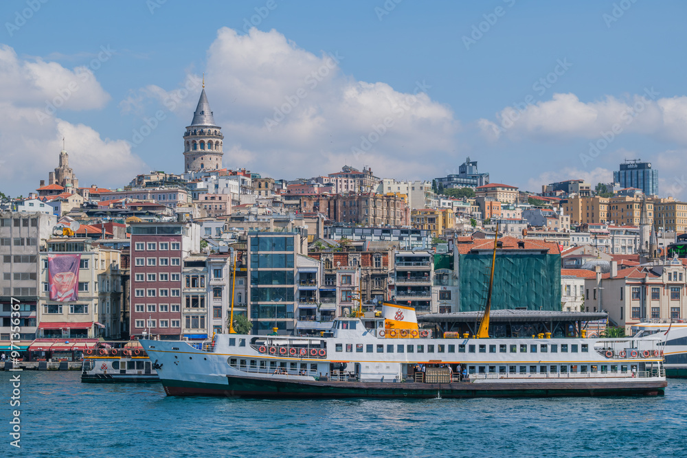 Fototapeta premium The Galata Tower and the Bosphorus offer a magnificent view with ferries