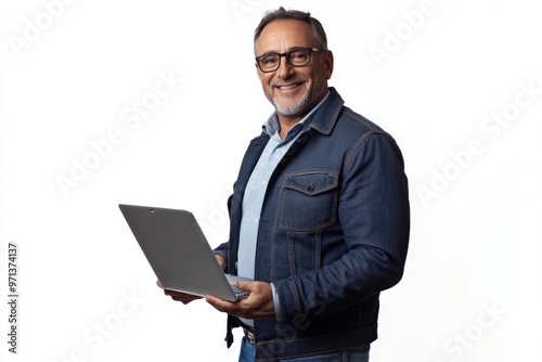 Middle aged businessman using laptop happy and smiling.