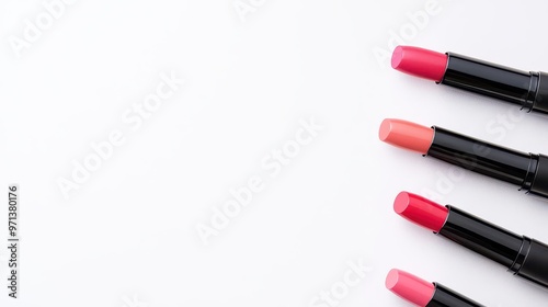 Flatlay of lipsticks with water reflections on a glossy white background, minimalist and hydrating concept, top view