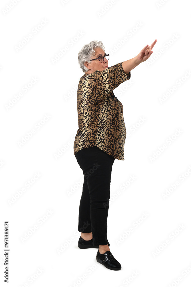 side view of asenior woman showing the horns sign with fingers on white background side view of asenior woman showing the horns sign with fingers on white background