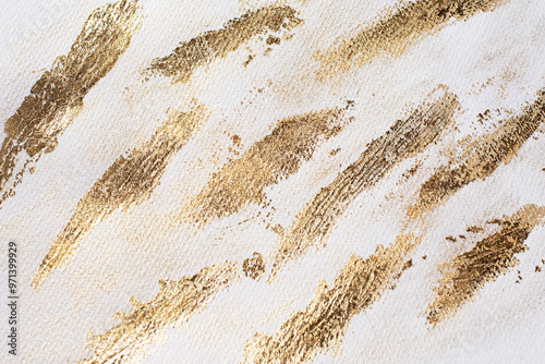 Golden shiny paper texture with glowing sparkles on beige watercolor background