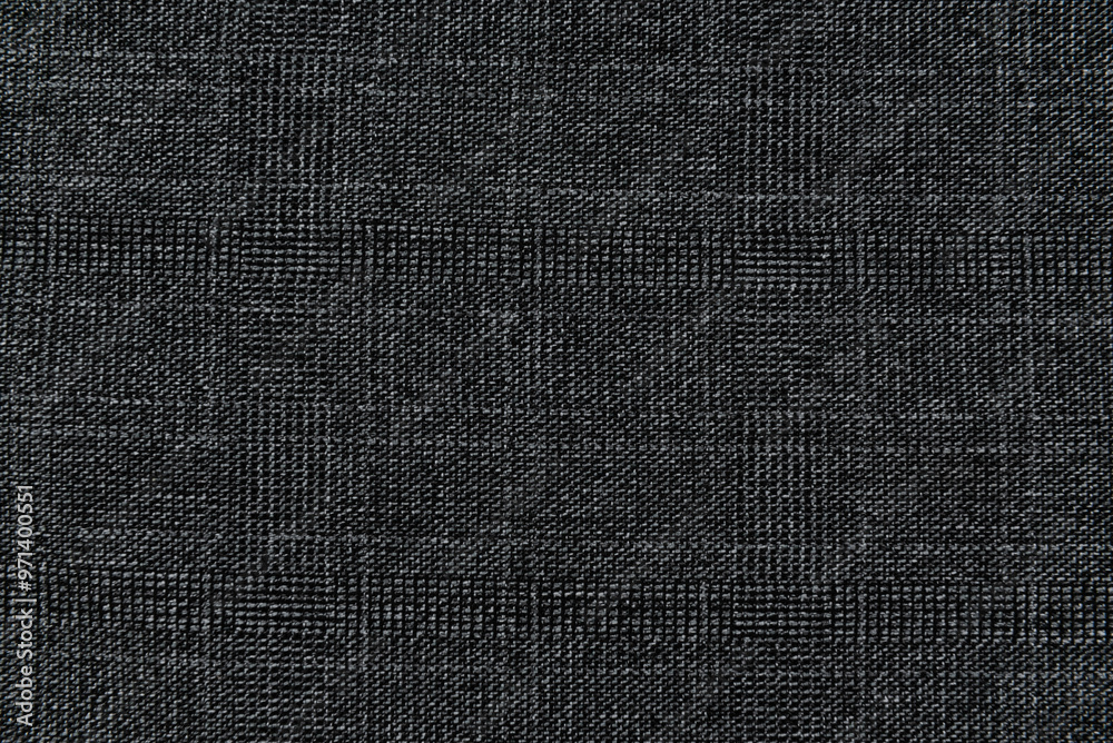 Fototapeta premium Texture of dense black fabric for tailoring. Canvas. Textile