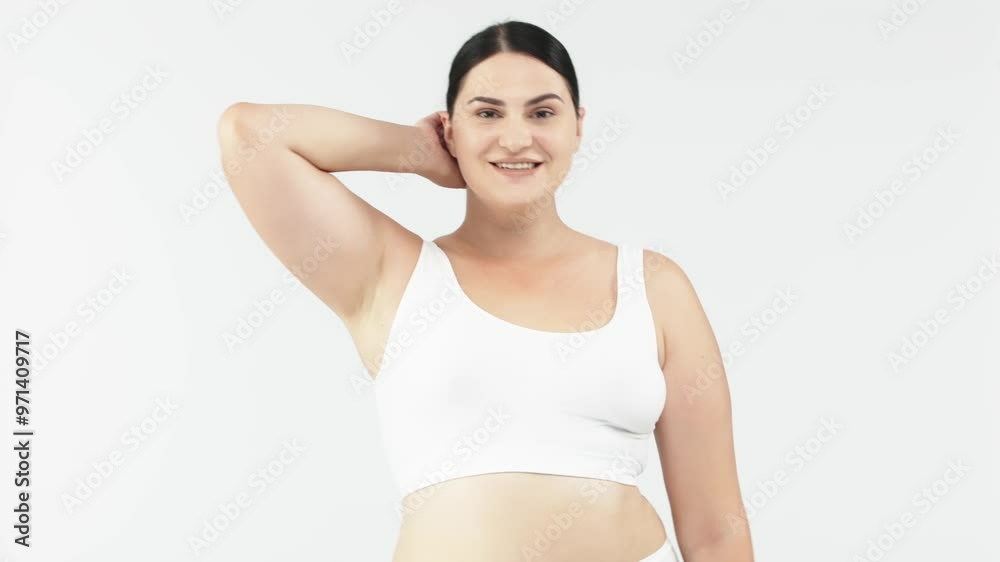 Attractive and cheerful woman dancing on a white background. Perfect for promoting body positivity, fitness, and weight loss, inspiring an active and healthy lifestyle. Attractive and cheerful woman dancing on a white background. Perfect for promoting body positivity, fitness, and weight loss, inspiring an active and healthy lifestyle.