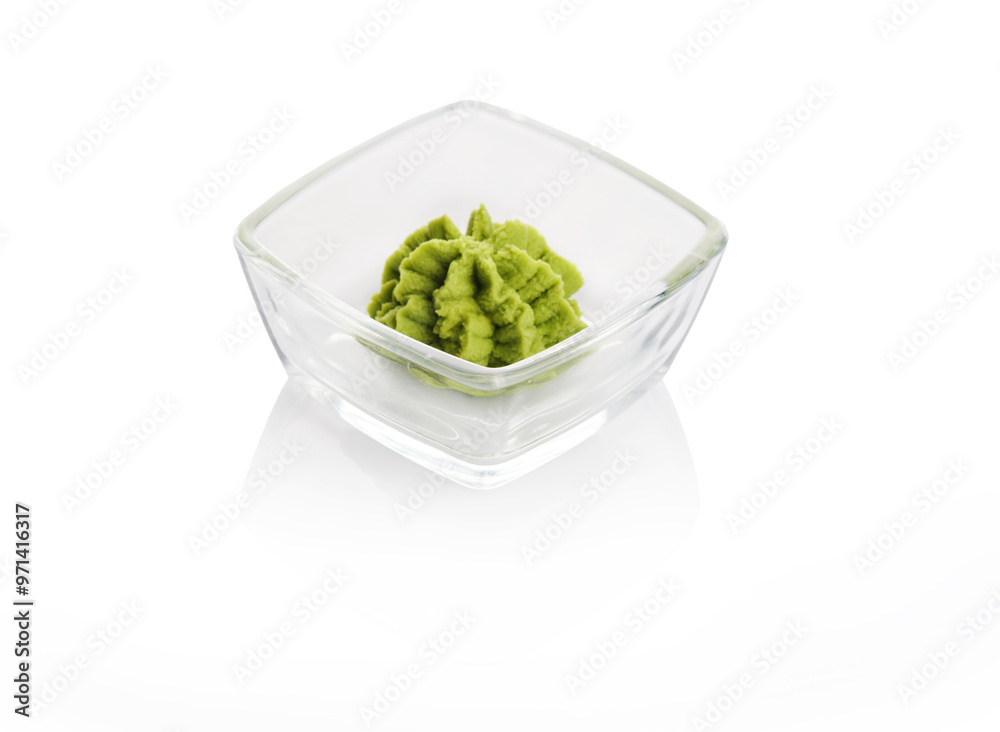 Fresh wasabi served in a glass dish for sushi dining experience in a modern restaurant setting Fresh wasabi served in a glass dish for sushi dining experience in a modern restaurant setting