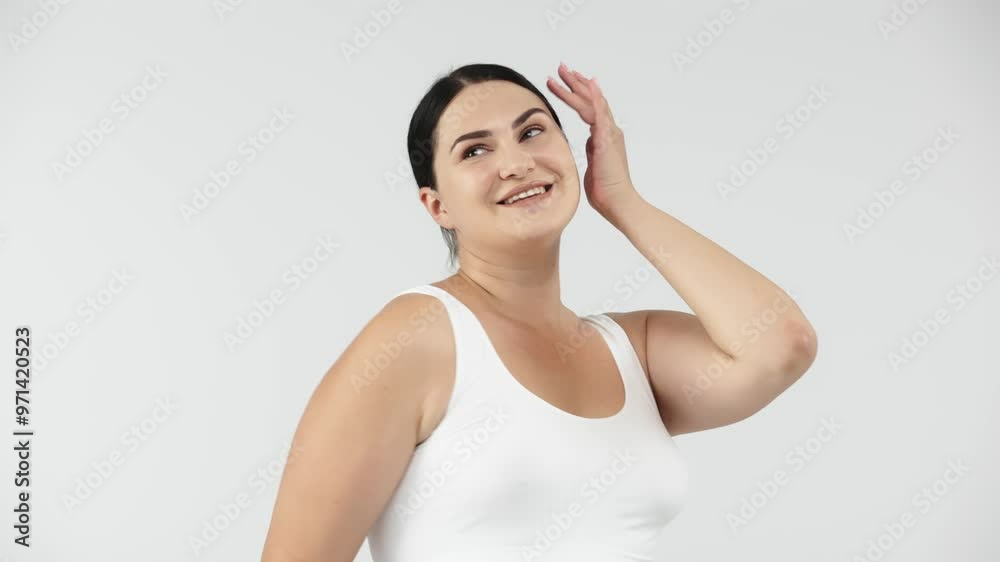 Attractive and cheerful woman dancing on a white background. Perfect for promoting body positivity, fitness, and weight loss, inspiring an active and healthy lifestyle. Attractive and cheerful woman dancing on a white background. Perfect for promoting body positivity, fitness, and weight loss, inspiring an active and healthy lifestyle.
