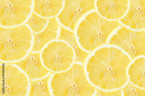 Yellow lemon slices background. Fruit pattern. Cut slices color texture. Lemon fruit section backdrop.