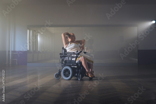 Elegant dressed-up woman with disability dancing in an electric wheelchair, spinning and gracefully moving. photo