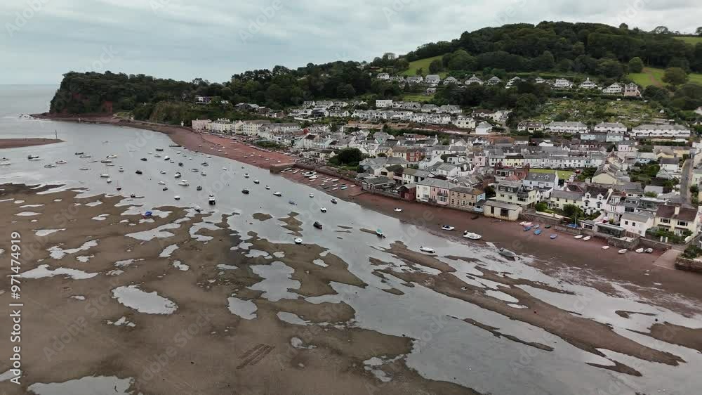Drone of the water in the foreground of the coastal Shaldon village with moored boats in Devon, UK Drone of the water in the foreground of the coastal Shaldon village with moored boats in Devon, UK
