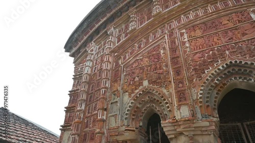 Famous Antpur Radhagovindjiu temple with crafted wood and exquisite terracotta carvings depicting stories from all 18 puranas. Here Swami Vivekananda took monastic vows in 1886, West Bengal, India photo