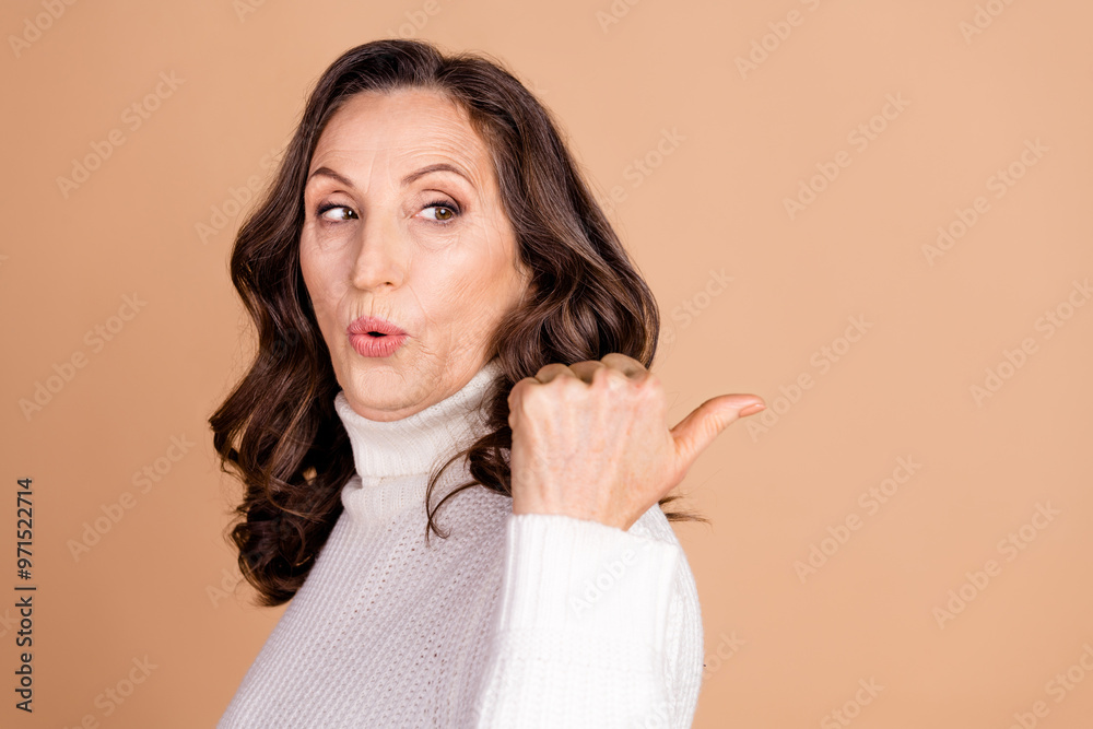Photo of lovely cute woman wear stylish clothes demonstrate discount empty space isolated on beige color background Photo of lovely cute woman wear stylish clothes demonstrate discount empty space isolated on beige color background